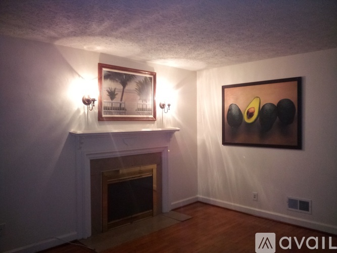 A room with a fireplace and a window.