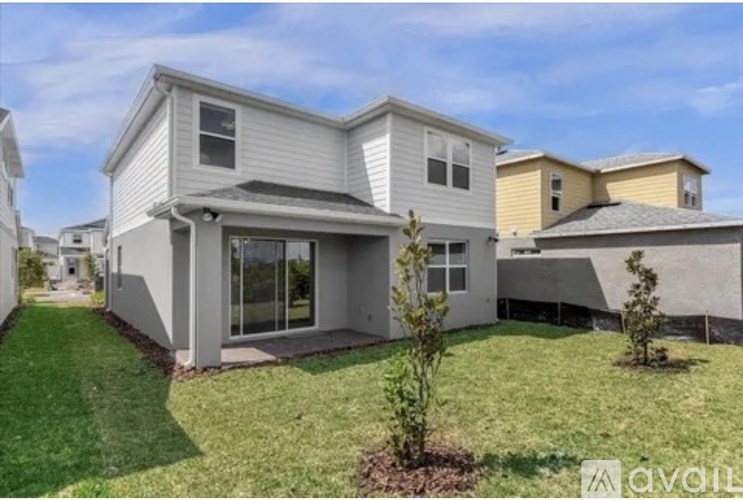 A house with a lawn in front of it is for sale.