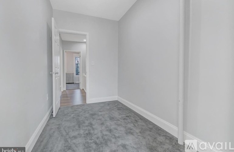 A long hallway with a door at the end.