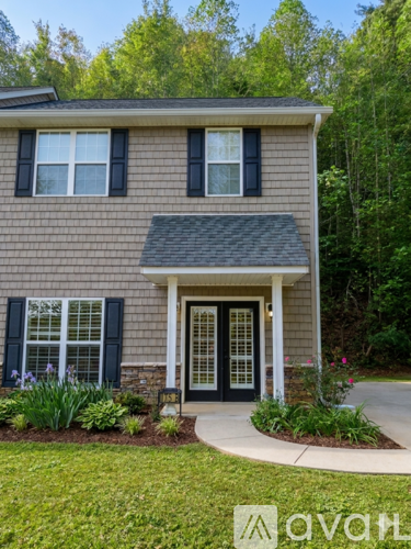 A house with a black door and white trim.