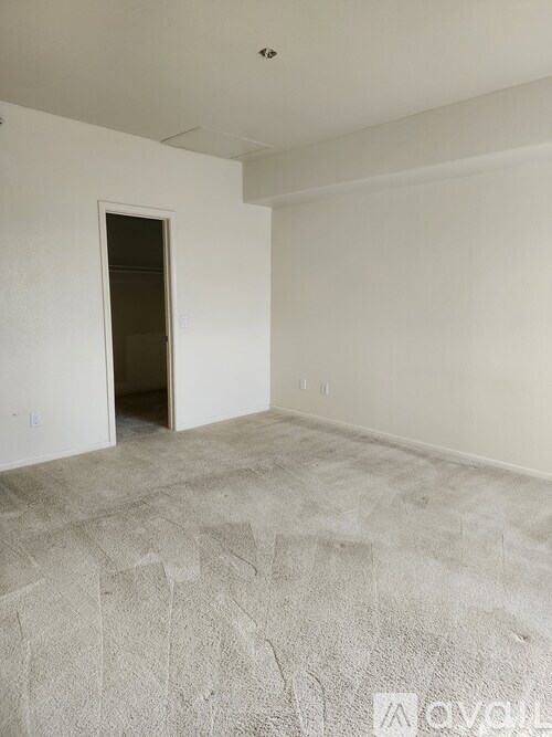 A room with a doorway leading to another room.