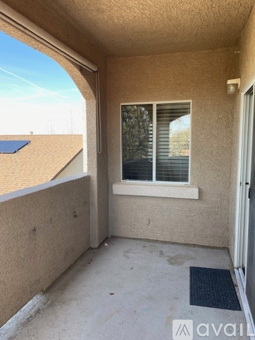 A balcony with a window and a door.