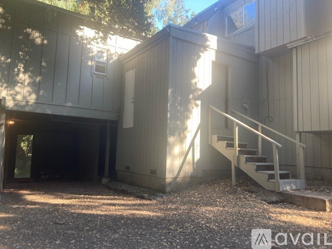 A house with a staircase leading to the second floor is for sale.