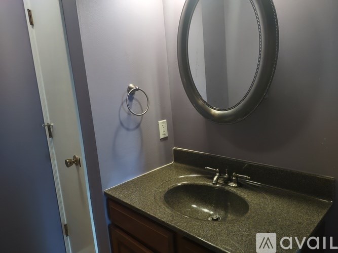 A bathroom with a sink and mirror.