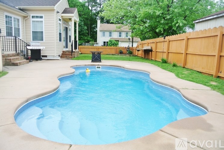A small residential pool in a backyard.