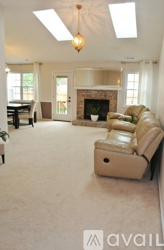 A living room with a fireplace and a couch.