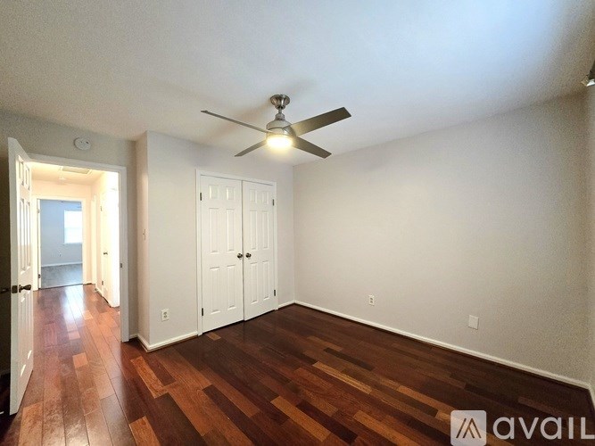 A brown leather sectional sofa in a living room.