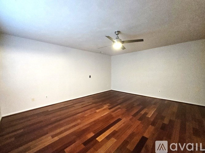 A living room with a fireplace and a dining table.