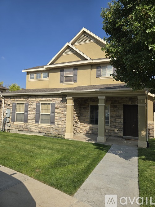 A house with a stone facade and a black door.