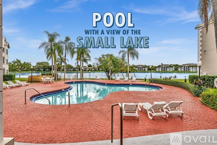 A pool with a view of the small lake.