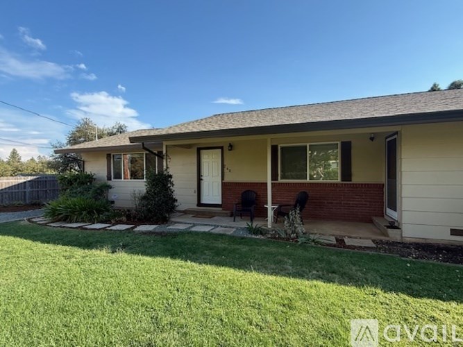 A house with a white door and a small porch.