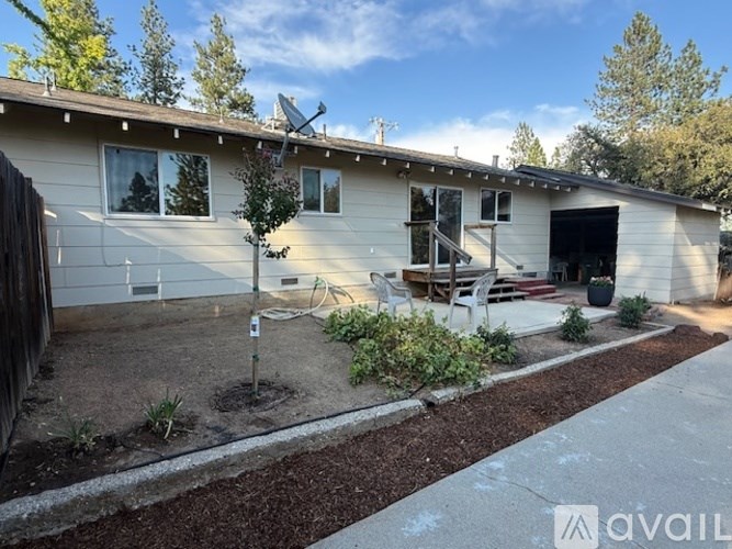 A house with a tree in front of it.