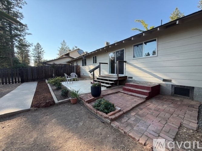 A house with a patio and a fireplace.
