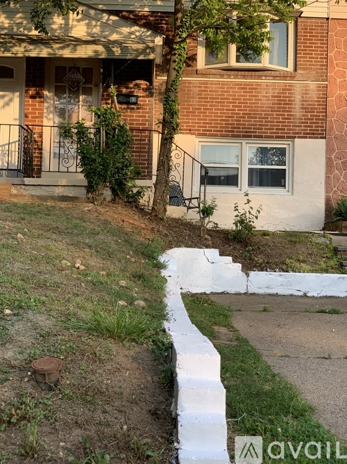 A house with a white fence in front of it.