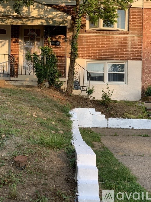 A house with a white fence in front of it.