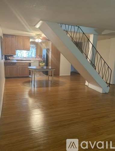 A room with a white door and three white cupboards.
