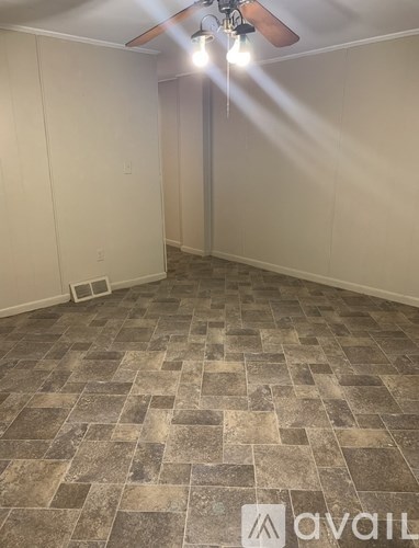 A white sink with a faucet is in a bathroom.