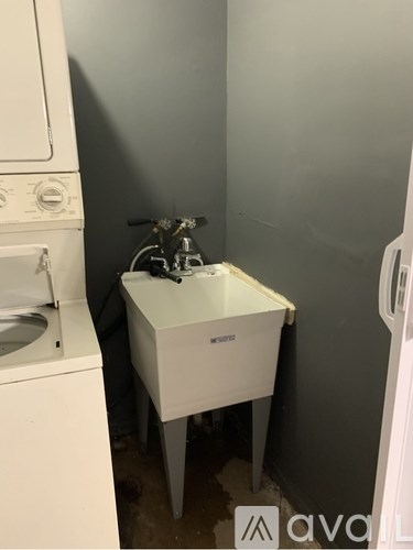 A staircase with a patterned carpet in front of it.