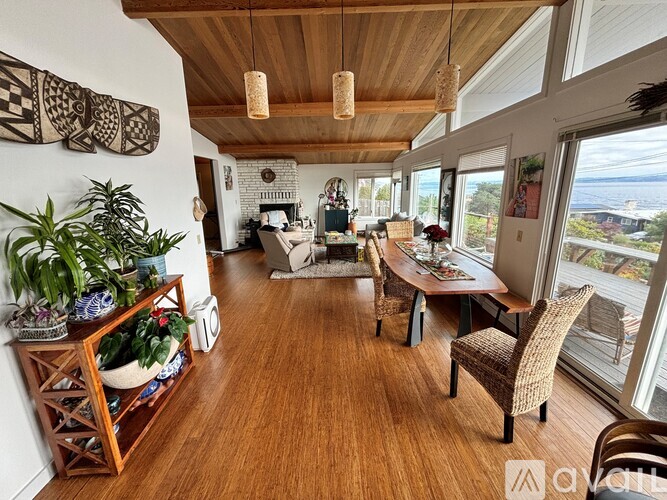 A living room with wooden floors and furniture.