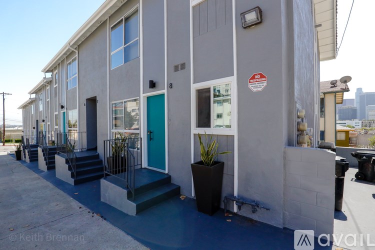 A building with a red and white sign on the wall.