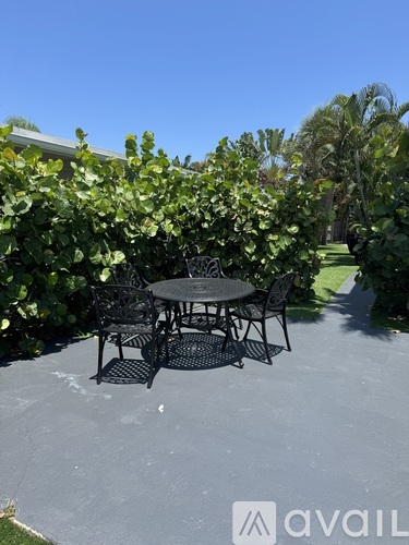 A table and chairs set up on a patio.