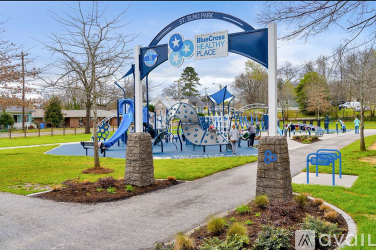 A playground with a sign that says "BlueCross Healthy Place".