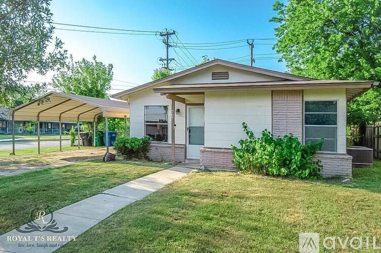 A house with a lawn in front of it is for sale.