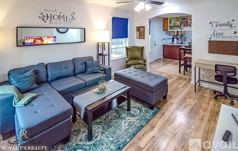 A living room with a grey sofa and a coffee table.