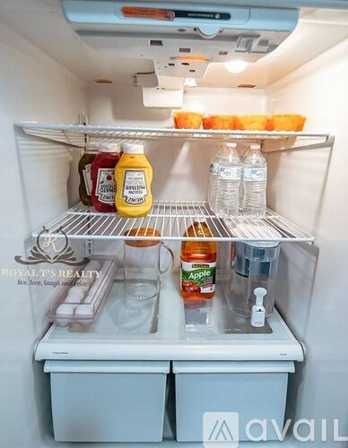 A refrigerator is full of food and drinks.
