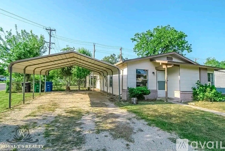 A house with a covered patio is for sale.