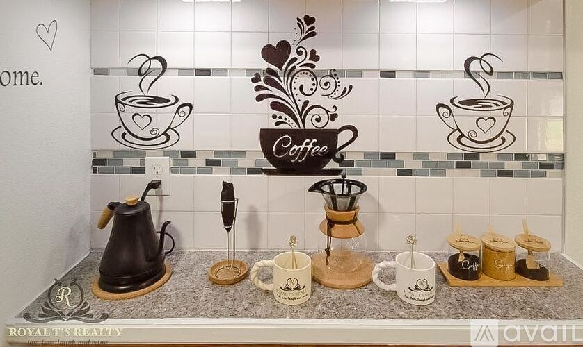 A coffee station with a coffee cup and a coffee pot.