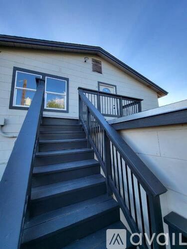A house with a staircase leading to the second floor.