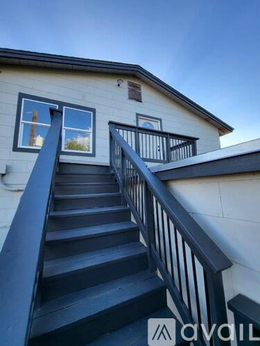 A house with a staircase leading to the second floor.