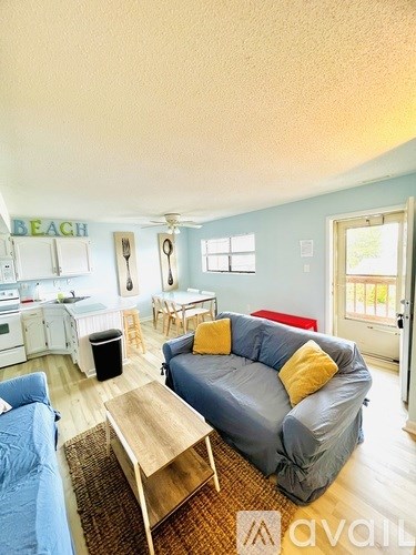 A living room with a couch and a table.