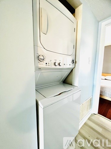 A white oven and dishwasher in a kitchen.