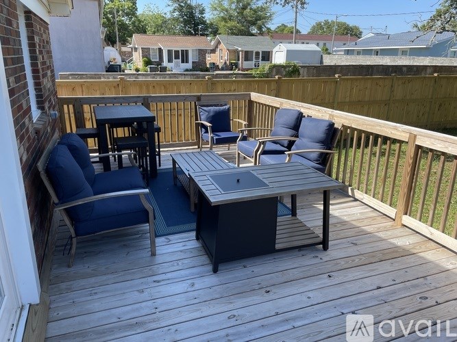 A deck with a table and chairs is shown.