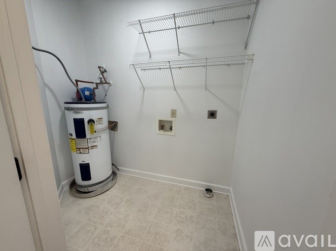 A white wall with a small hole in it.