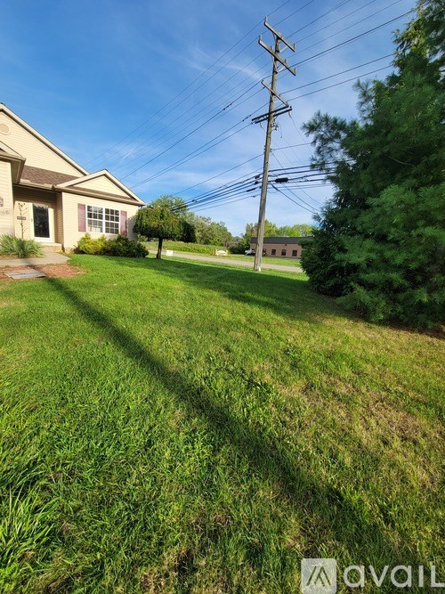 A house with a lawn in front of it.