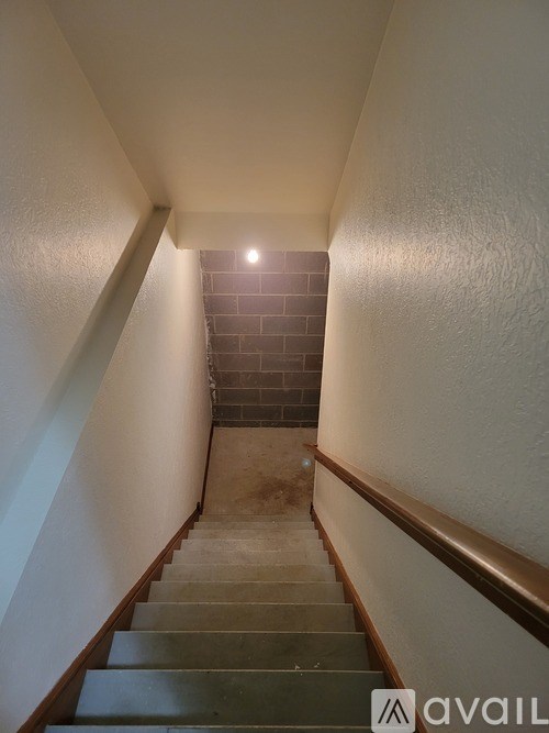 A staircase with a light at the top.