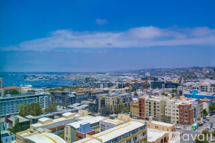 A cityscape with buildings and a clear sky.