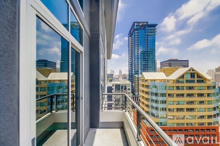 A balcony with a view of a city skyline.