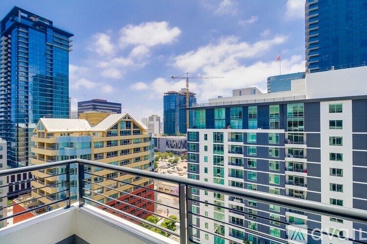 A cityscape with a clear sky and a building with the word "evotel" on it.