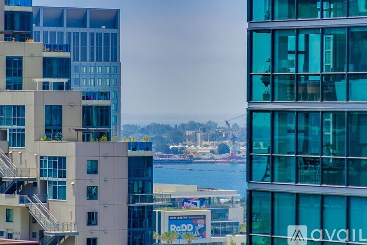 A view of a cityscape with a body of water and buildings.