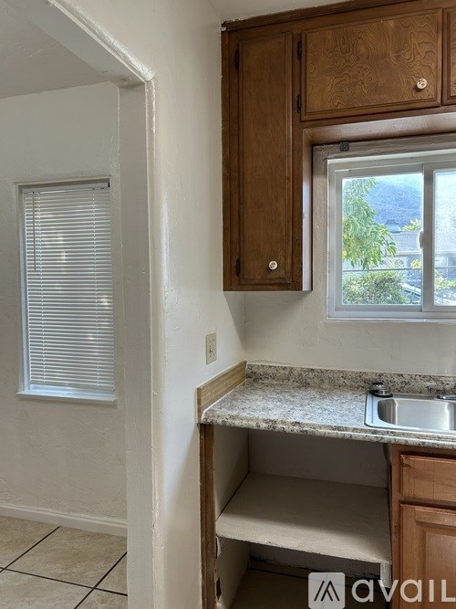 A kitchen with a window and a sink.