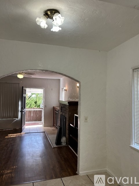 A living room with a couch and a fireplace.