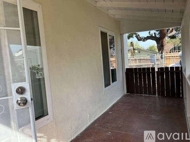A patio with a door and a window.