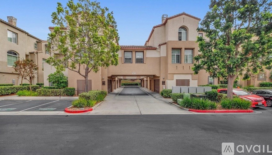 A building with a parking lot in front of it.