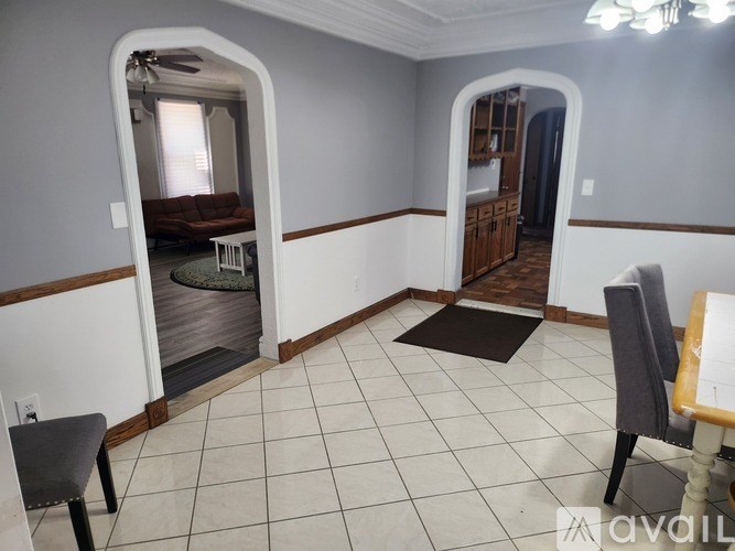 A living room with a couch and a chair.