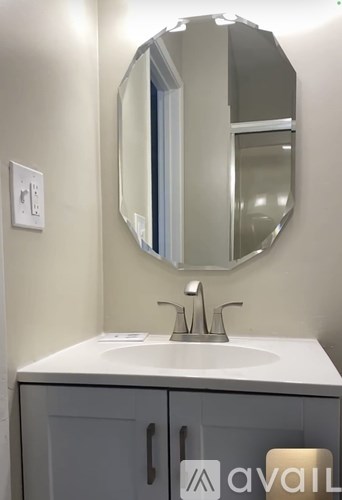 A bathroom sink with a mirror above it.