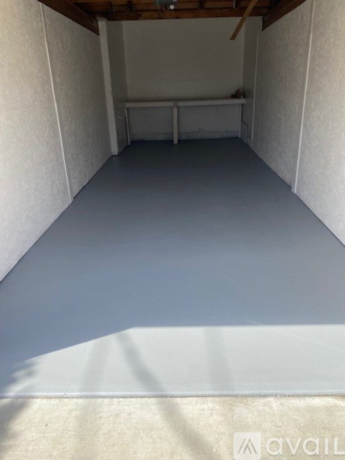 A room with white walls and a concrete floor.